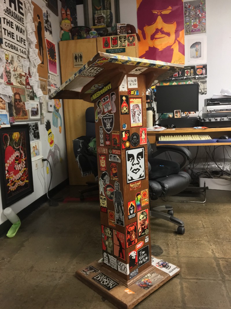 A sticker-covered lectern in Bryan's classroom